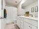 Bathroom featuring a white vanity, toilet, shower with curtain, and neutral tile flooring at 1017 Cheviot Ct, Waxhaw, NC 28173