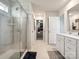 Bright bathroom featuring a glass shower, white vanity with sink and natural light at 1017 Cheviot Ct, Waxhaw, NC 28173