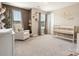 Charming Bedroom with crib, comfortable chair, and a serene, neutral color palette at 1017 Cheviot Ct, Waxhaw, NC 28173