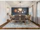 Formal dining area with stylish decor, a modern chandelier, and comfortable seating for sophisticated dining at 1017 Cheviot Ct, Waxhaw, NC 28173