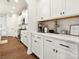Bright kitchen featuring white cabinets, stainless appliances and a coffee station at 1017 Cheviot Ct, Waxhaw, NC 28173