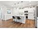 Spacious kitchen featuring a large island, stainless appliances, pendant lighting, and ample cabinet space at 1017 Cheviot Ct, Waxhaw, NC 28173