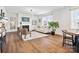 Bright living area featuring fireplace, comfortable seating, large rug, and natural lighting at 1017 Cheviot Ct, Waxhaw, NC 28173