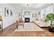 Elegant living room showcasing a fireplace, built-in shelving, and stylish decor with plenty of natural light at 1017 Cheviot Ct, Waxhaw, NC 28173
