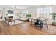 Bright and airy living room with a fireplace, built-in shelving, and large windows with natural light at 1017 Cheviot Ct, Waxhaw, NC 28173