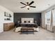Stunning main bedroom featuring a modern accent wall, plush bed, and elegant furnishings at 1017 Cheviot Ct, Waxhaw, NC 28173