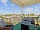 Relax on this screened porch with comfortable wicker furniture and a cozy fire pit perfect for outdoor entertaining at 1017 Cheviot Ct, Waxhaw, NC 28173