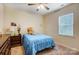 Charming bedroom featuring a window with blinds and a ceiling fan at 11296 Serenity Farm Dr, Midland, NC 28107