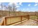 Wooden deck overlooking wooded area with a distant view at 11296 Serenity Farm Dr, Midland, NC 28107