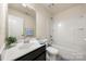 The bathroom has a vanity with storage, a toilet, and a shower-tub combination with white tile at 113 Burlingame Ct # D, Mooresville, NC 28117