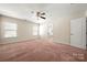Bedroom with neutral carpet, a ceiling fan, and natural light at 113 Burlingame Ct # D, Mooresville, NC 28117