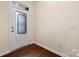View of entryway with decorative glass door and hardwood floors at 113 Burlingame Ct # D, Mooresville, NC 28117