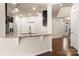 Open kitchen layout with countertop seating and stainless steel appliances at 113 Burlingame Ct # D, Mooresville, NC 28117