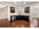 Well-lit kitchen features stainless steel dishwasher and dark wood cabinets at 113 Burlingame Ct # D, Mooresville, NC 28117