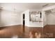 Open-concept living area with hardwood floors and bar seating at 113 Burlingame Ct # D, Mooresville, NC 28117