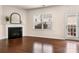 Bright living room featuring a fireplace, hardwood floors, and natural light at 113 Burlingame Ct # D, Mooresville, NC 28117