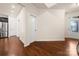Open floor plan with hardwood floors offering a view into the kitchen and foyer at 113 Burlingame Ct # D, Mooresville, NC 28117