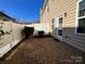 The paved outdoor patio space is enclosed by a white vinyl fence at 113 Burlingame Ct # D, Mooresville, NC 28117