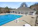 Community pool featuring ample seating, covered patio, and lifeguard stand, ready for summer fun at 113 Burlingame Ct # D, Mooresville, NC 28117