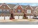 Charming brick townhomes boast two-car garages and classic architectural details at 113 Burlingame Ct # D, Mooresville, NC 28117