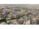 Wide aerial shot of a community surrounded by a dense forest at 11501 Candlelight Ct, Charlotte, NC 28226
