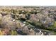 Scenic aerial shot highlighting the home's location within a lush, tree-filled neighborhood at 11501 Candlelight Ct, Charlotte, NC 28226