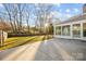 Large backyard featuring a spacious patio, grassy area, and privacy fence at 11501 Candlelight Ct, Charlotte, NC 28226