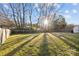 Large, well-maintained backyard with ample green space and a wooden fence at 11501 Candlelight Ct, Charlotte, NC 28226