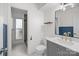 The bathroom has a vanity, toilet, mirror, and a shower with gray brick-look tile at 11501 Candlelight Ct, Charlotte, NC 28226