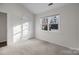 Bedroom with a closet, carpet, and natural light from a large window at 11501 Candlelight Ct, Charlotte, NC 28226