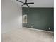 A bedroom features a large window, and a large wall that is painted dark green at 11501 Candlelight Ct, Charlotte, NC 28226