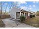 Charming single-story home with inviting porch, complemented by neat landscaping and a welcoming entrance at 11501 Candlelight Ct, Charlotte, NC 28226