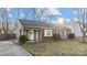 Charming single-story home showcasing a brick facade, complemented by a well-manicured lawn and inviting entrance at 11501 Candlelight Ct, Charlotte, NC 28226