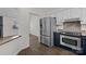The kitchen has stainless steel appliances, granite countertops, and wood-look flooring at 11501 Candlelight Ct, Charlotte, NC 28226