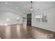 Open living room featuring a fireplace, hardwood floors, and multiple windows at 11501 Candlelight Ct, Charlotte, NC 28226