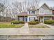 Charming townhome featuring blue shutters, a well-manicured lawn, and a welcoming entrance at 12601 Tucker Crossing Ln, Charlotte, NC 28273