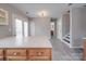 Open floor plan featuring an island with hardwood floors and access to backyard at 12601 Tucker Crossing Ln, Charlotte, NC 28273