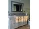 Bright bathroom with double sinks, marble countertops, and ample storage in white cabinetry at 12662 Woodside Falls Rd, Pineville, NC 28134