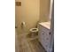 Powder room featuring white vanity with chrome hardware and a tile floor at 12662 Woodside Falls Rd, Pineville, NC 28134