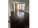 Bright bedroom featuring beautiful dark wood floors and lots of natural light at 12662 Woodside Falls Rd, Pineville, NC 28134