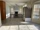 Open concept living room boasts lots of natural light, a fireplace, and hardwood floors at 12662 Woodside Falls Rd, Pineville, NC 28134