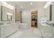 The bathroom includes double vanities, a soaking tub, and a walk-in closet at 129 Tuckernuck Dr, Mooresville, NC 28117
