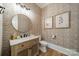 A stylish powder room features a decorative mirror, woven wallpaper, and a modern vanity at 129 Tuckernuck Dr, Mooresville, NC 28117