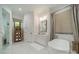 The bathroom features a standalone soaking tub, vanity with a mirror, and a glass shower at 129 Tuckernuck Dr, Mooresville, NC 28117