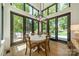 Bright dining area with black framed windows, hardwood floors and a modern chandelier at 129 Tuckernuck Dr, Mooresville, NC 28117