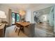 Elegant dining room with a modern chandelier, neutral tones, and a view of the staircase at 129 Tuckernuck Dr, Mooresville, NC 28117