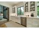 The kitchen includes a farmhouse sink, stainless steel dishwasher and glass front cabinets at 129 Tuckernuck Dr, Mooresville, NC 28117
