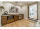 Kitchenette with sink, microwave, mini-fridge, and wooden cabinets at 129 Tuckernuck Dr, Mooresville, NC 28117