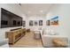 Relaxing living room with comfortable seating, large TV, and movie posters, great for entertainment at 129 Tuckernuck Dr, Mooresville, NC 28117
