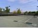 Well-maintained tennis court at a golf course community with a view of luxury homes at 129 Tuckernuck Dr, Mooresville, NC 28117